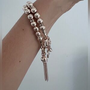 Elegant Gold Beaded Bracelet with Tassel Charm